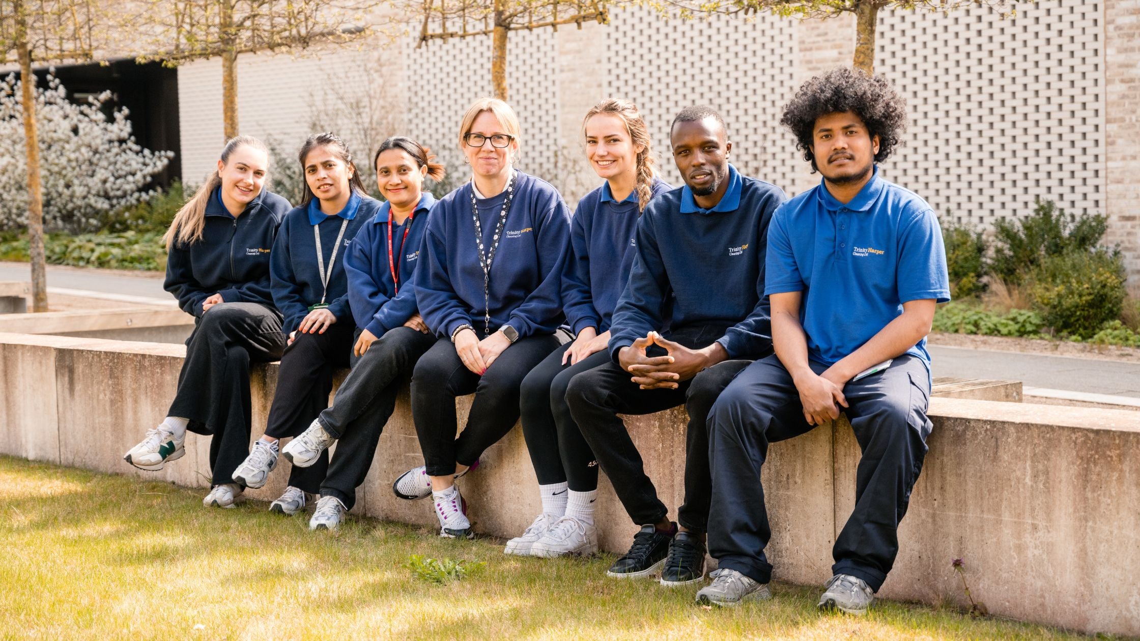 Image of a diverse range of employees of Trinity Harper in blue workwear