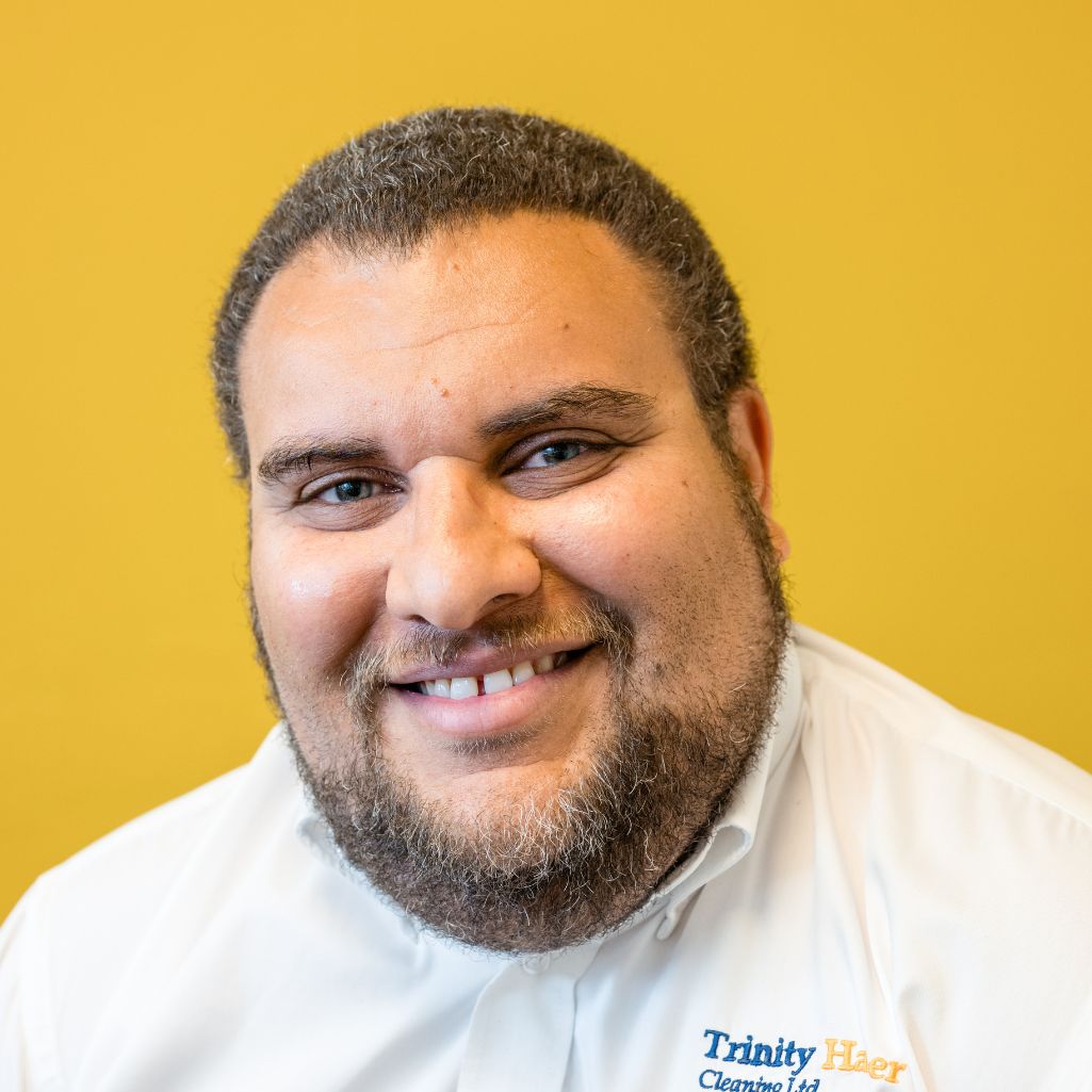 Close up of man with a beard and a white shirt